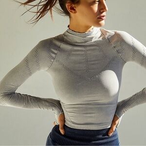 31. FP movement by Free People- Good karma high neck top- M/L NWOT